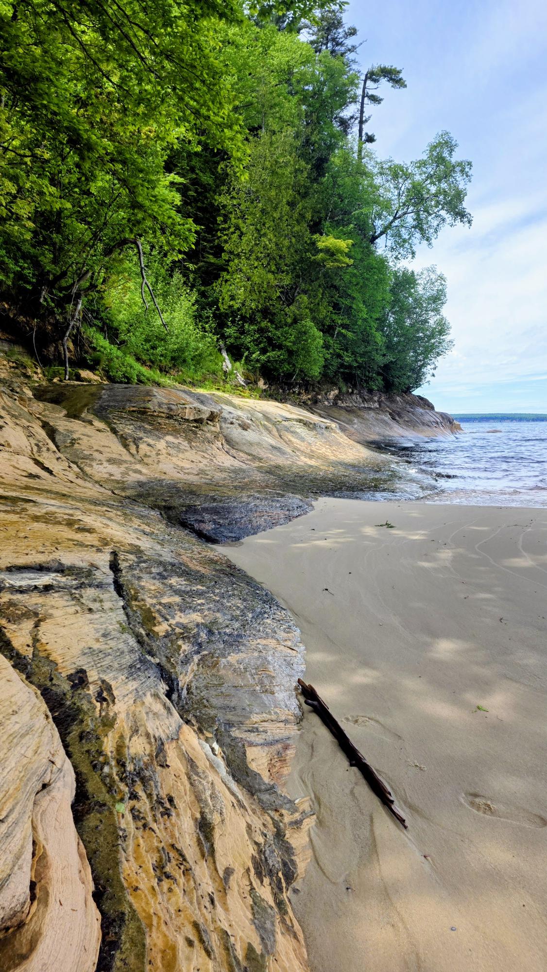 Rocky shoreline along a quiet lake
